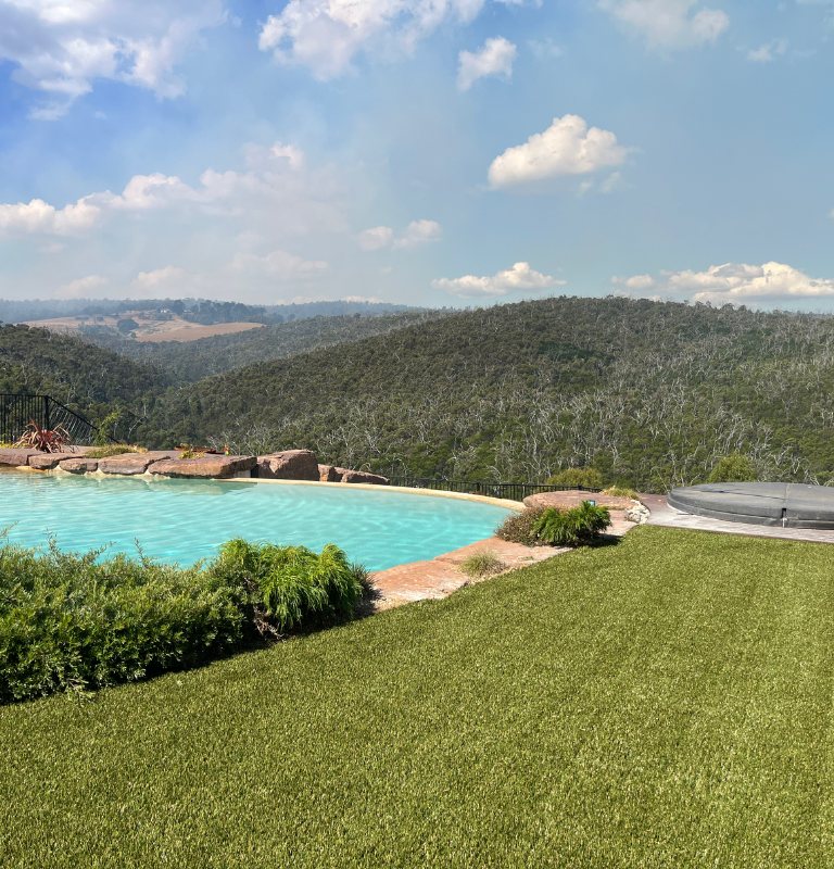 Poolside artificial grass with bushland outlook